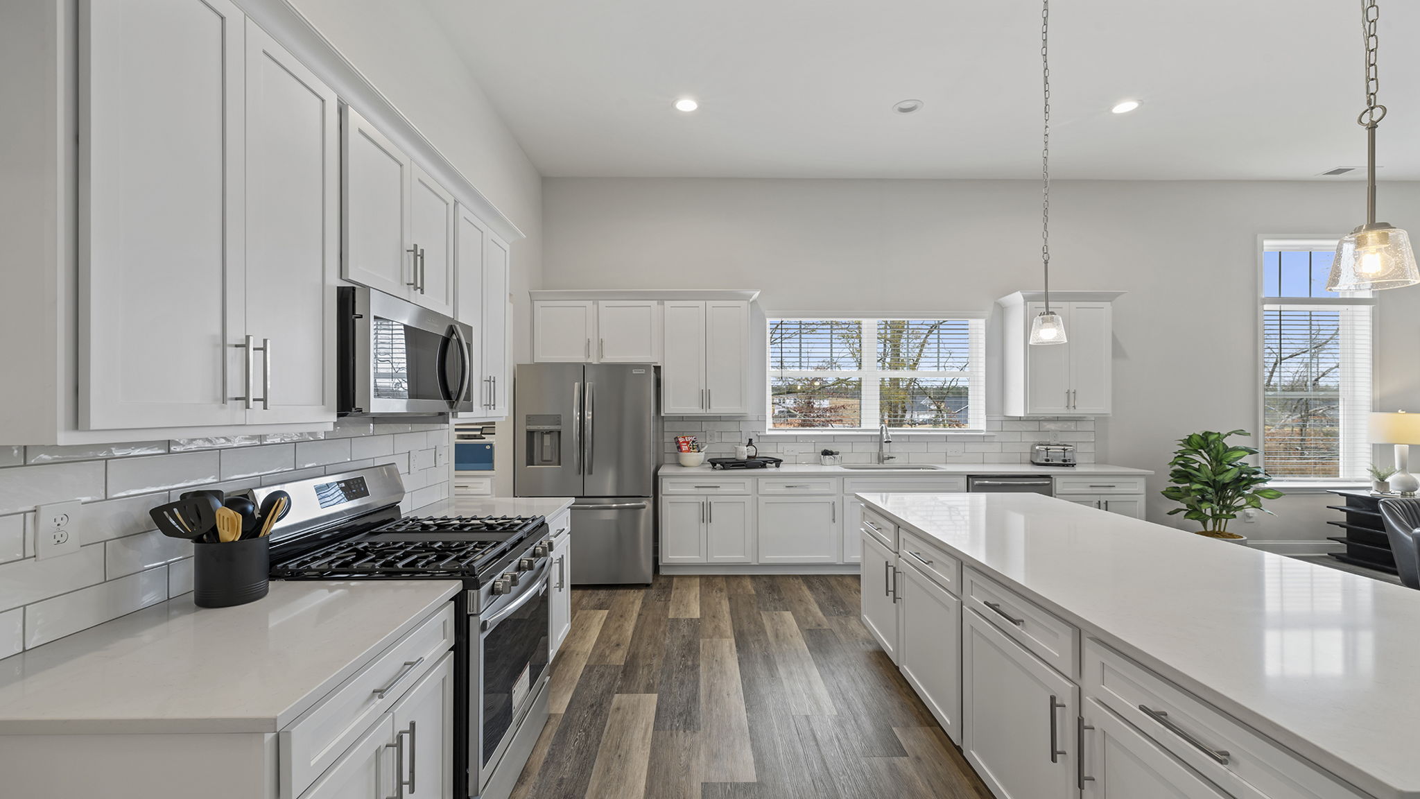 Kitchen and island with granite counter tops.