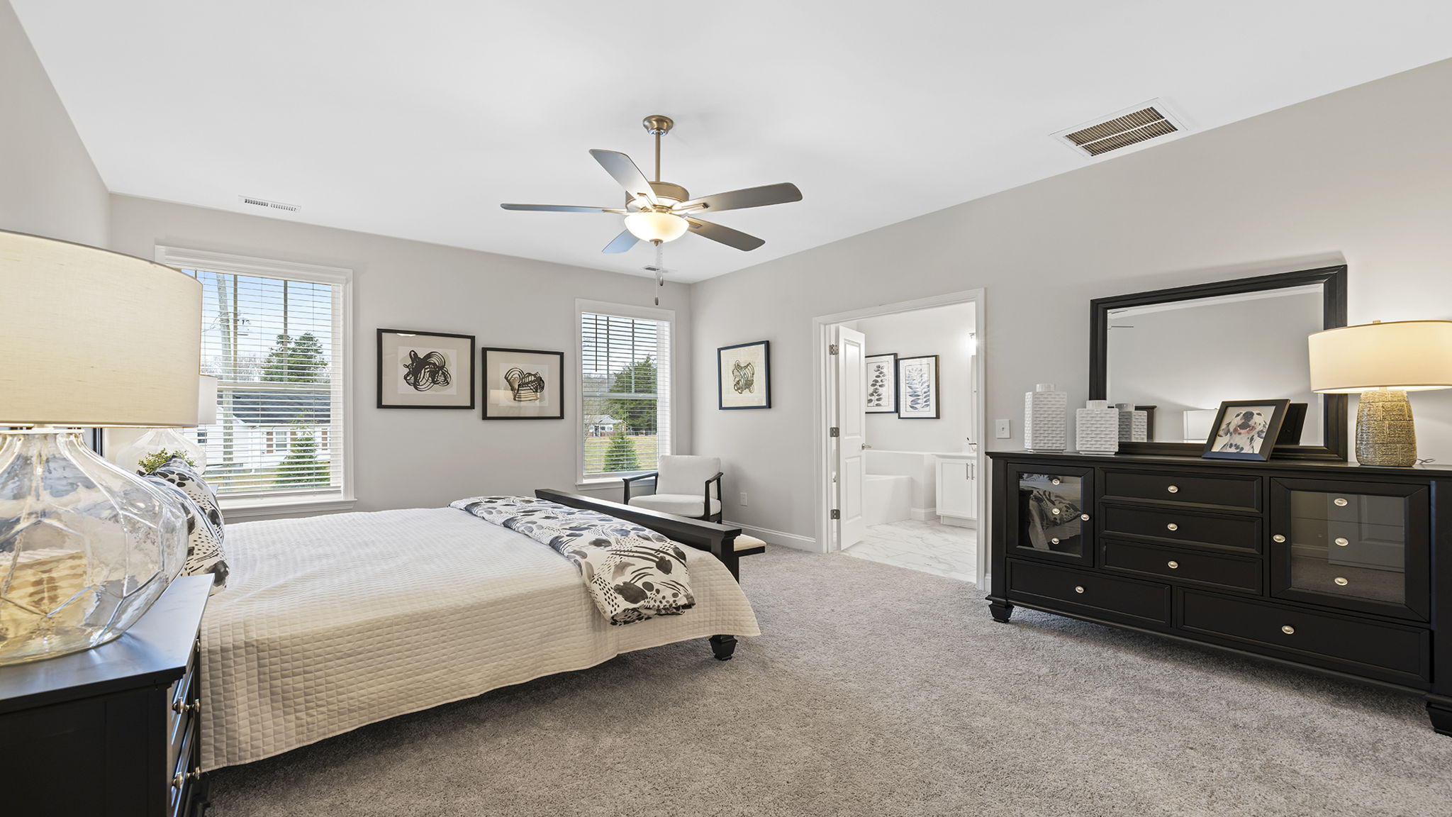 Bedroom with carpet and window.