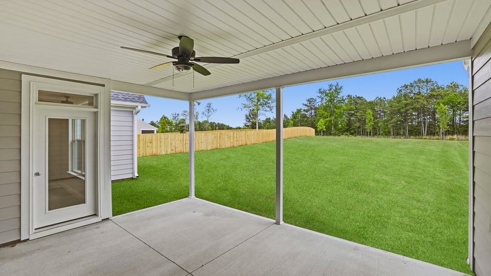Covered porch at back of home.