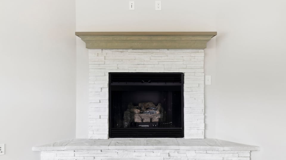 Family room with fireplace and windows.