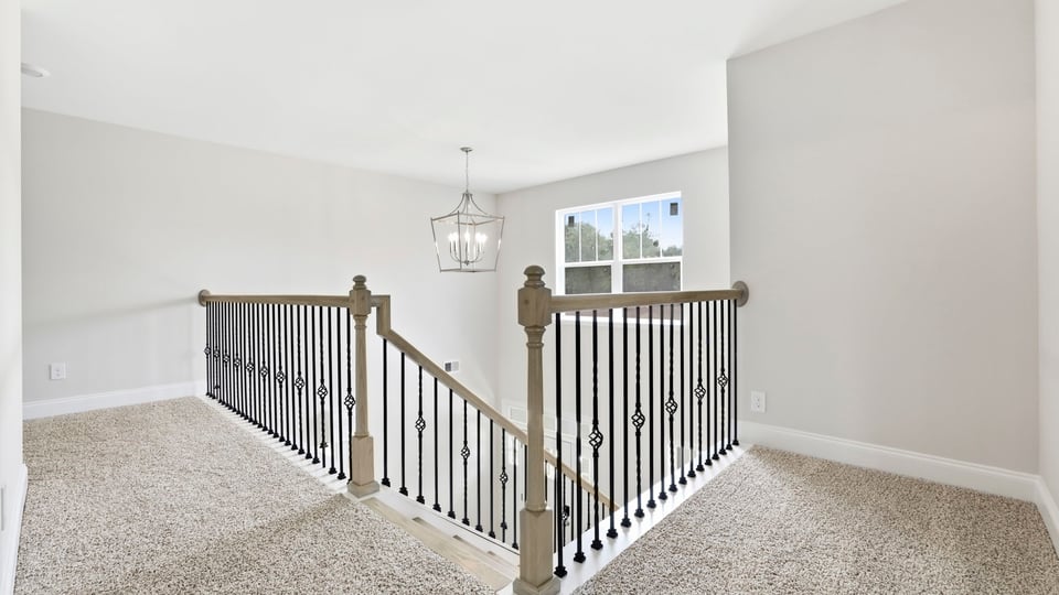 Loft area with carpet.