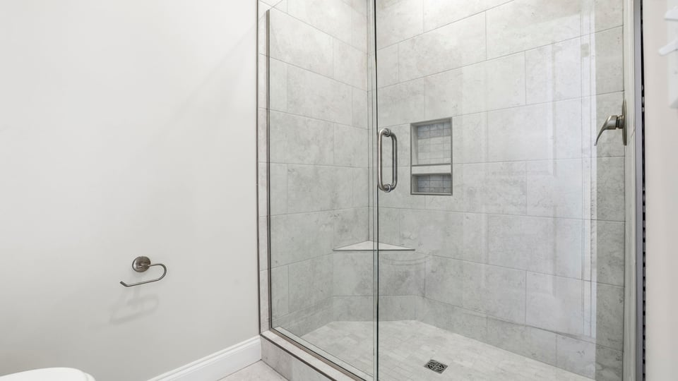 Bathroom with walk in shower.