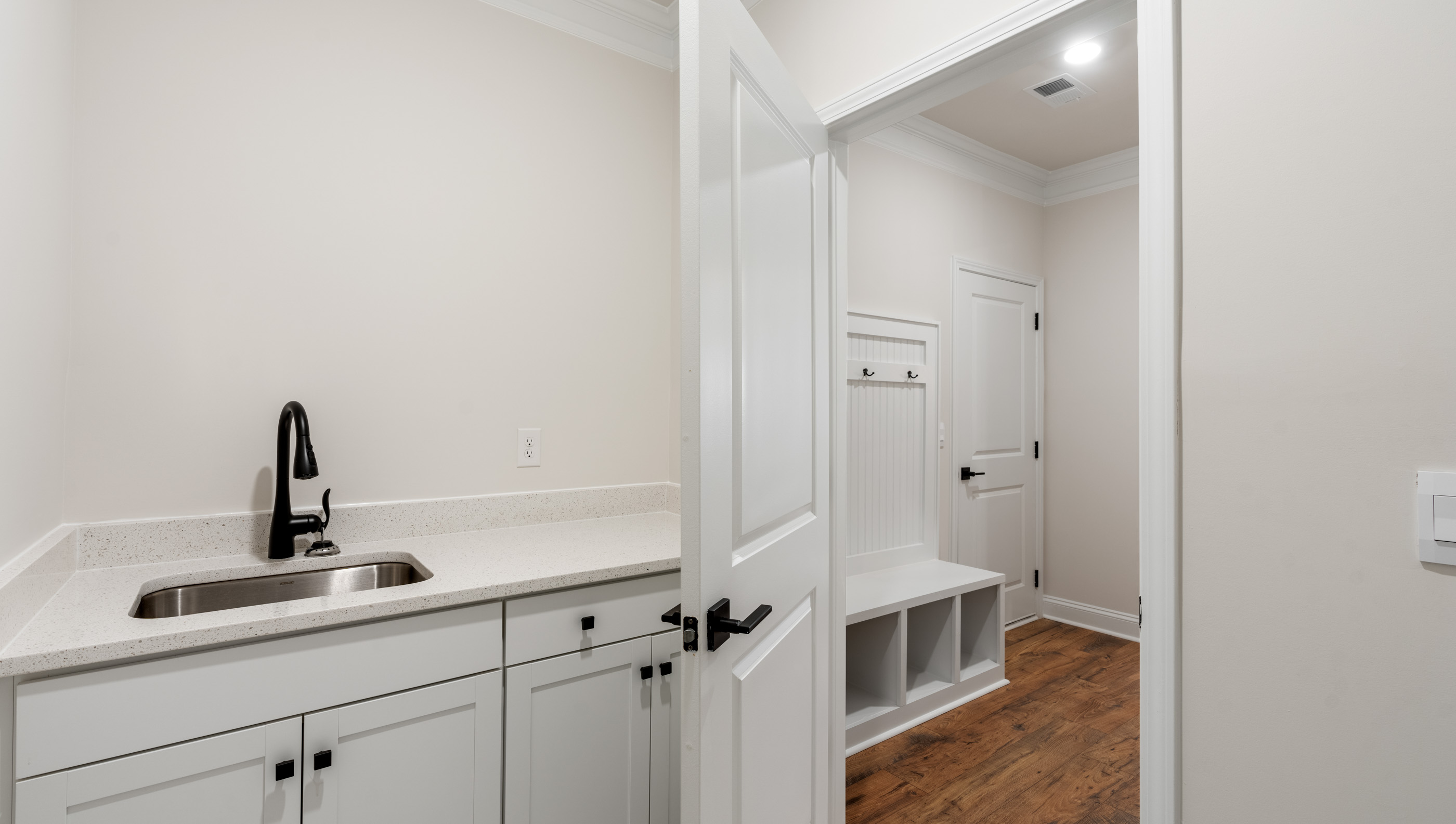 Laundry room with storage.