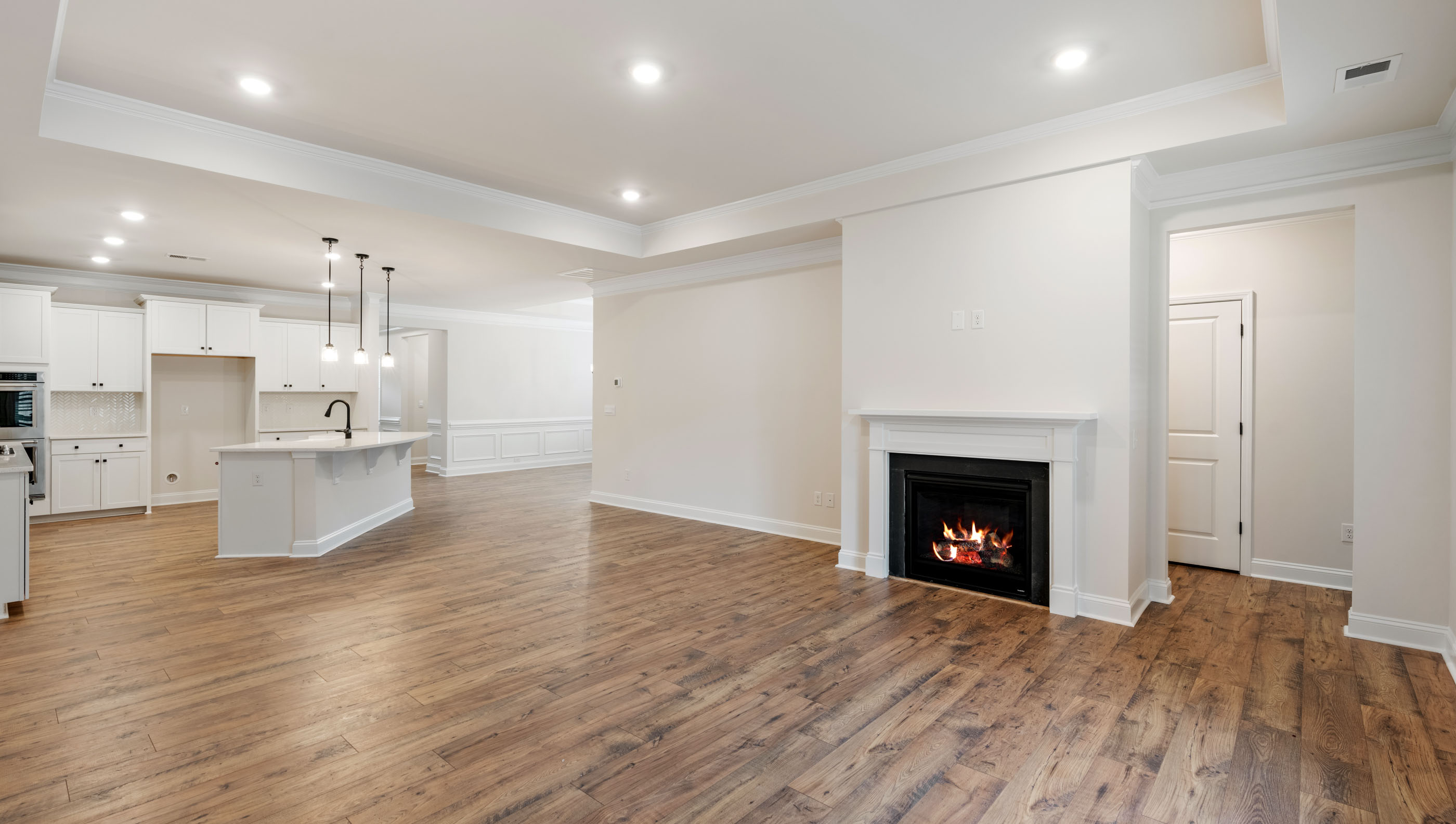 Family room with fireplace and windows.