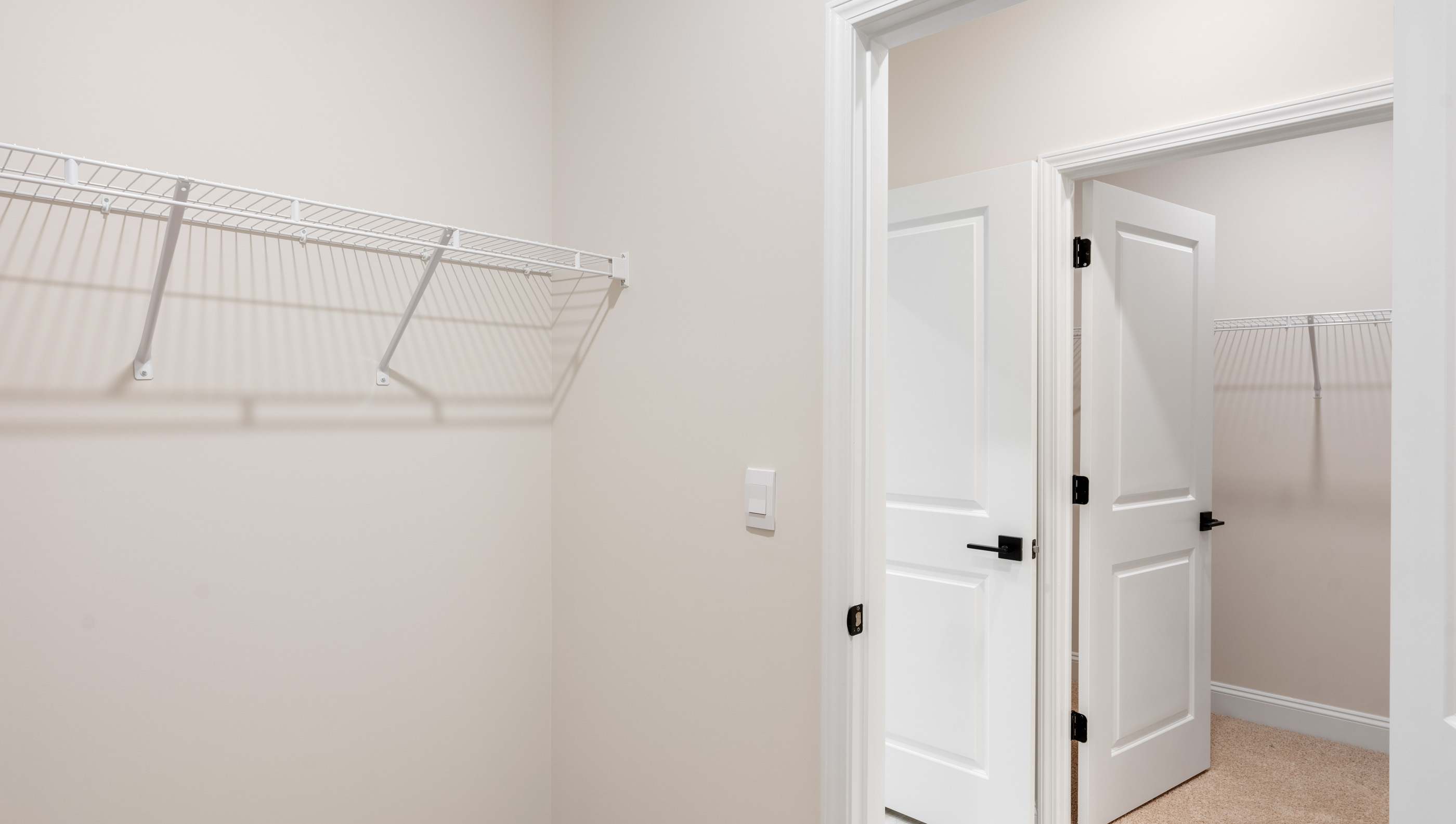 Closet with hanging storage racks.