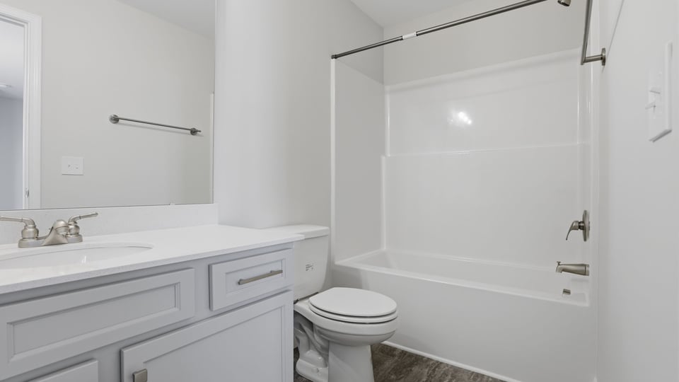 Bathroom with single vanity sink and shower.