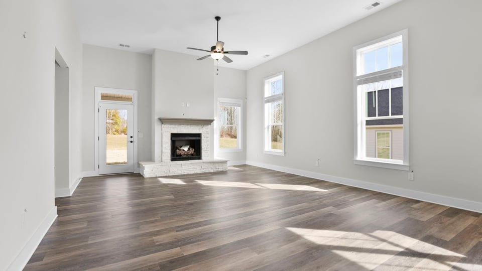 Family room with windows and fireplace.