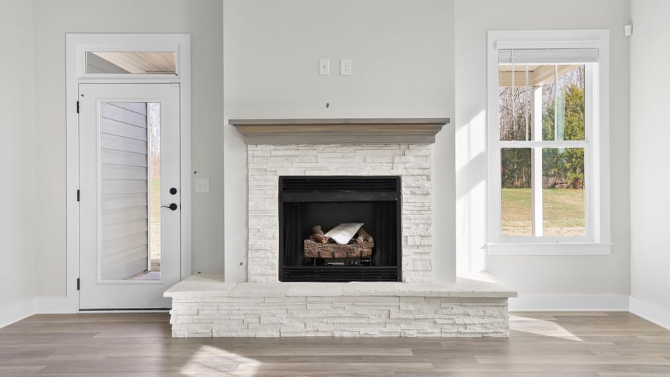 Family room with windows and fireplace.