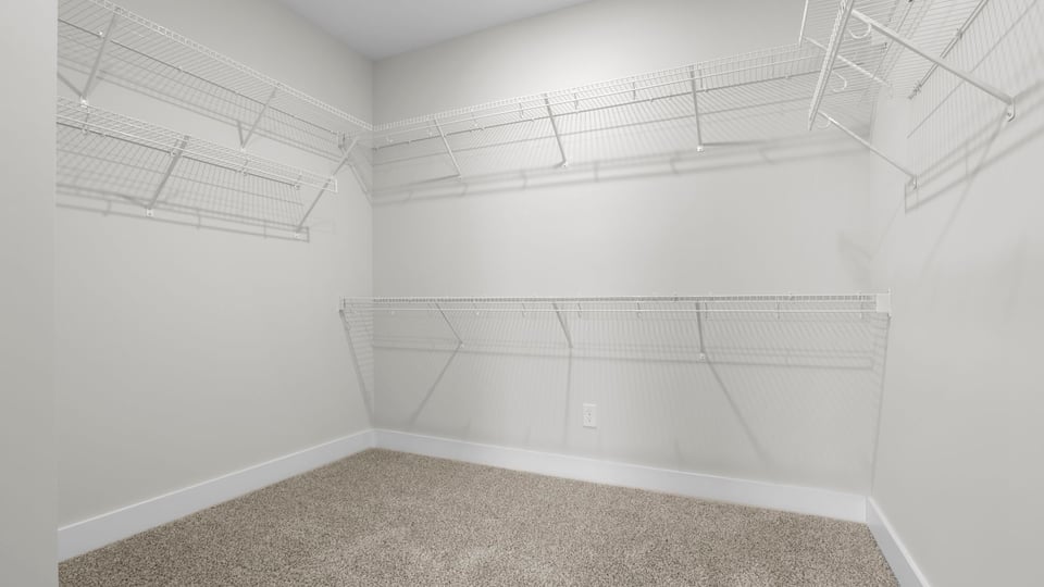 Closet with hanging storage racks.