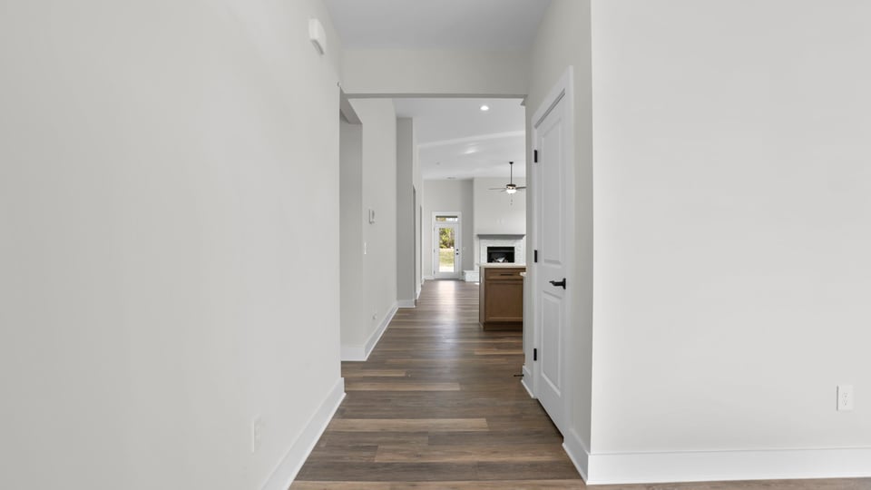 Entry way into home with view of rooms.