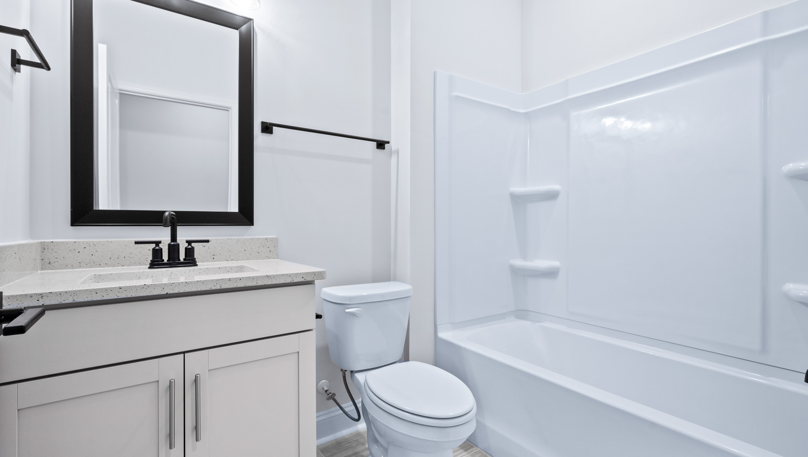 Bathroom with tub and vanity.