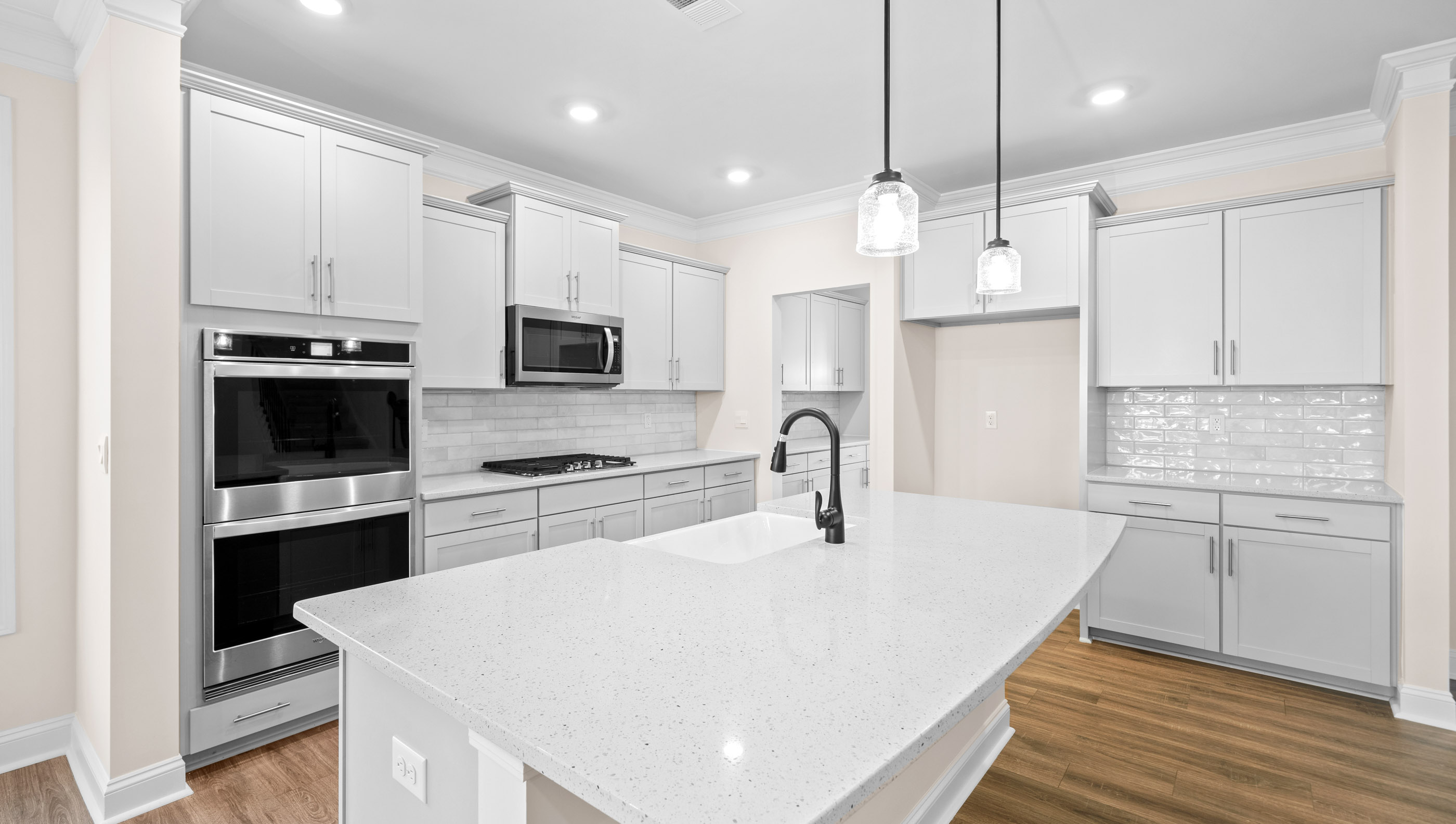 Kitchen with countertops and island of home.