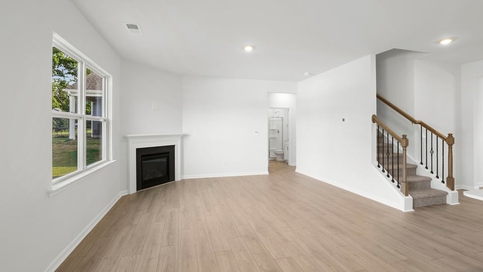 Livingroom with window and fireplace.