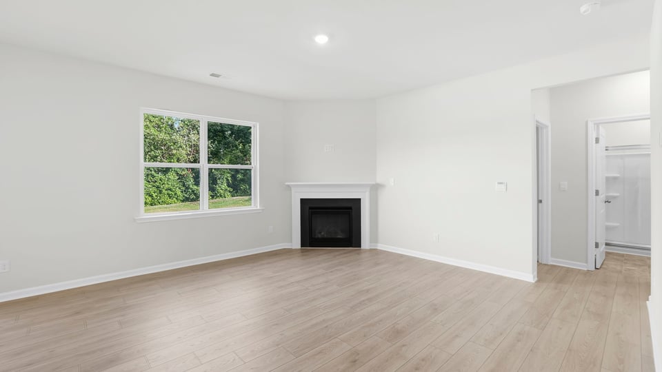 Livingroom with window and fireplace.