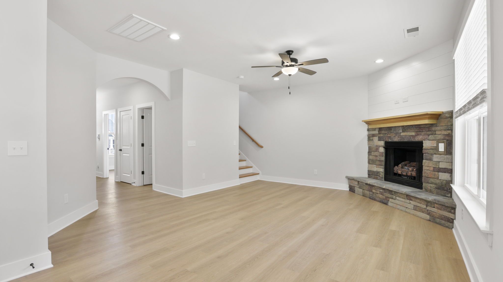 Family room with windows and fireplace.