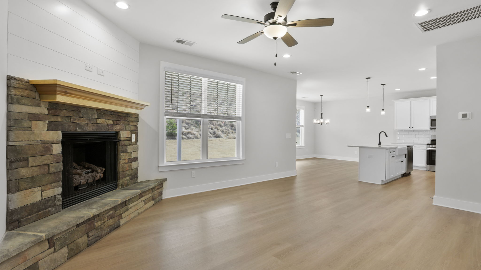 Family room with windows and fireplace.