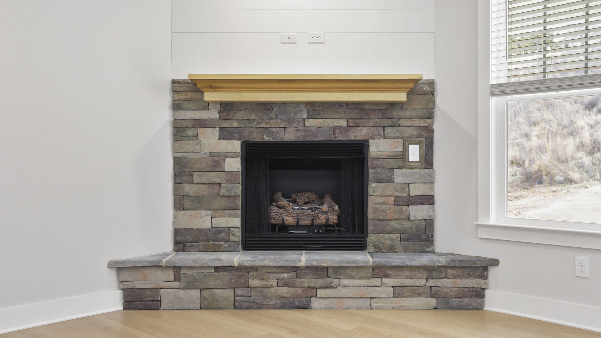 Family room with windows and fireplace.