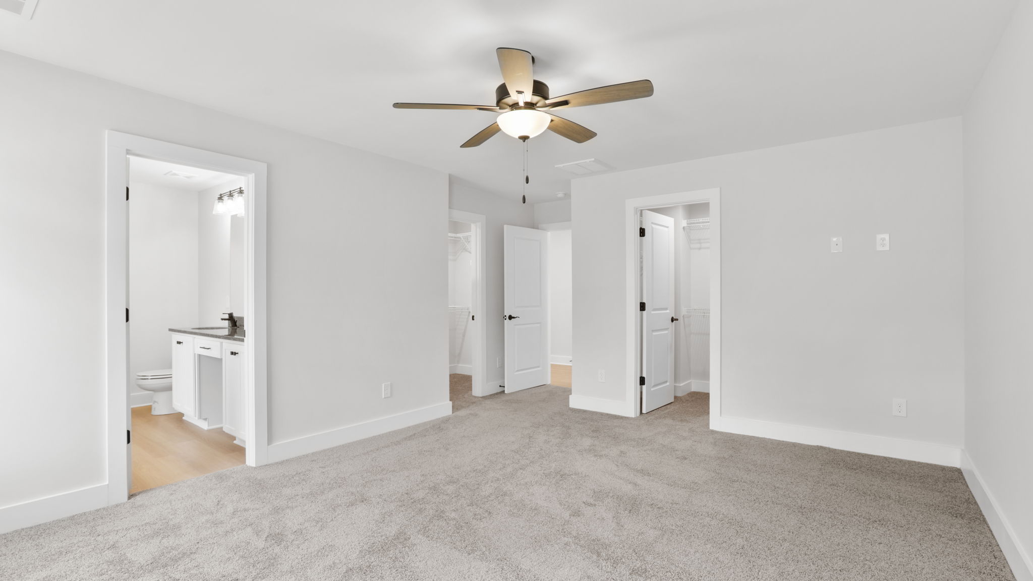Bedroom with carpet and window.