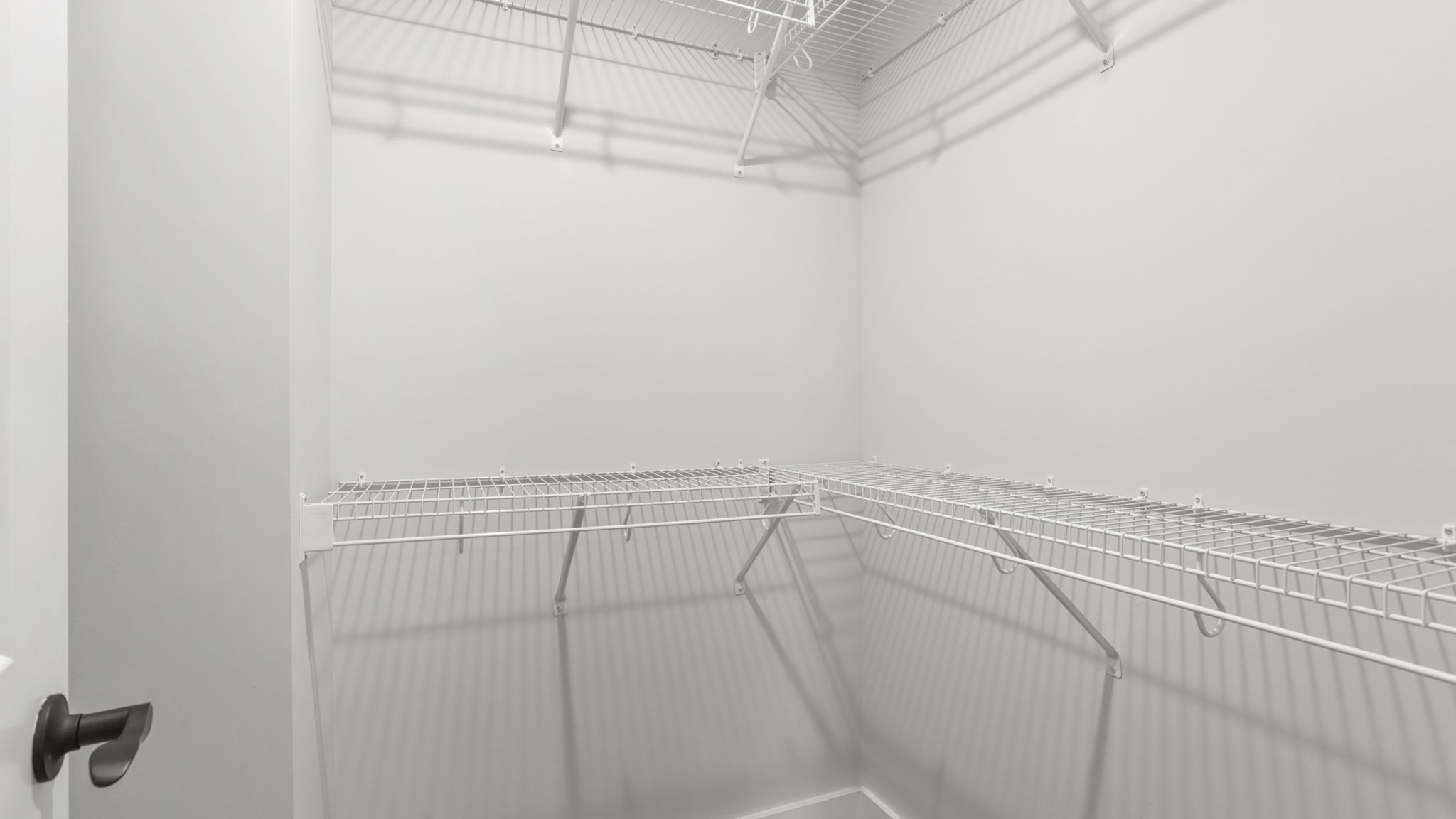 Closet with hanging storage racks.