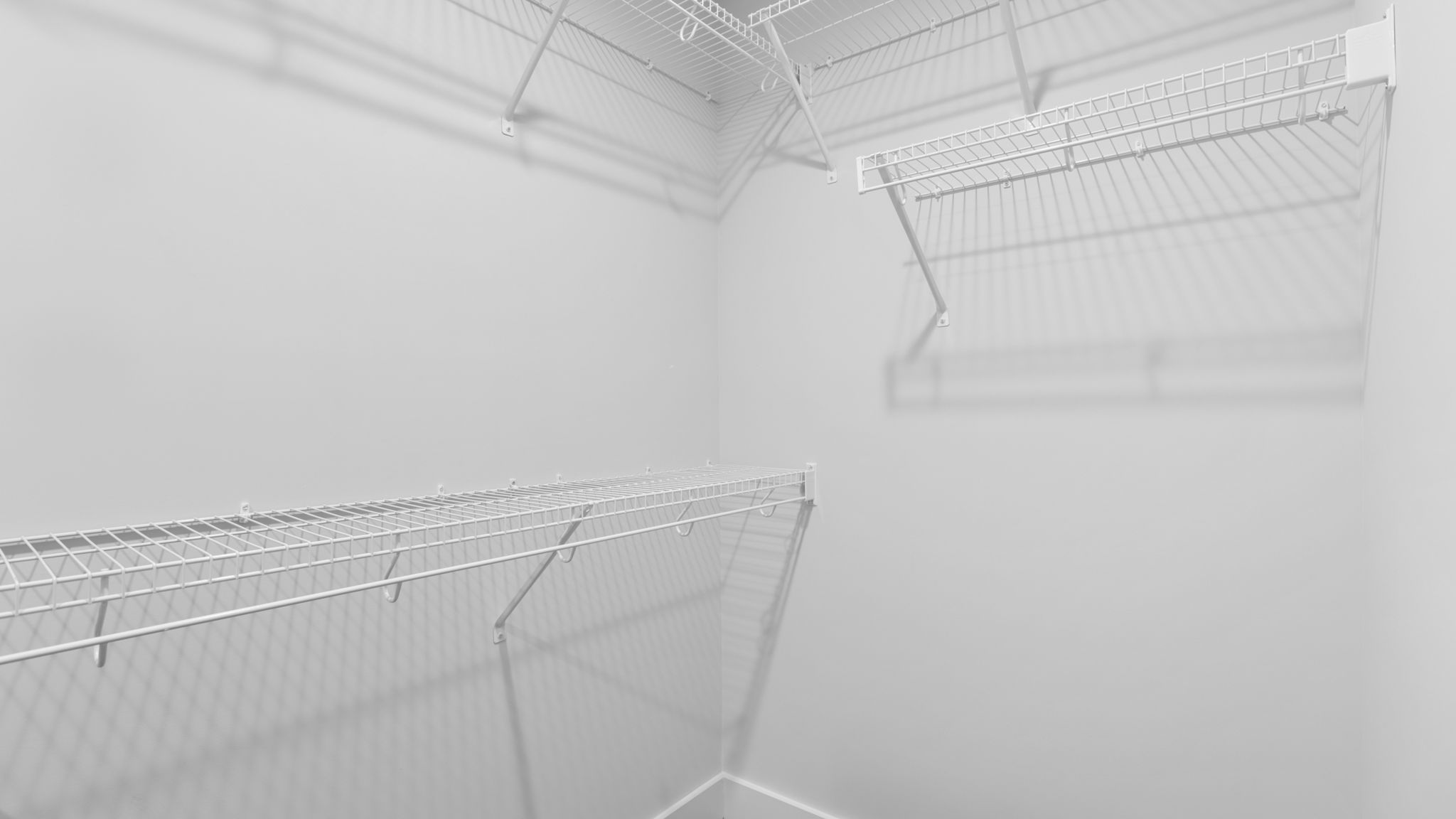 Closet with hanging storage racks.