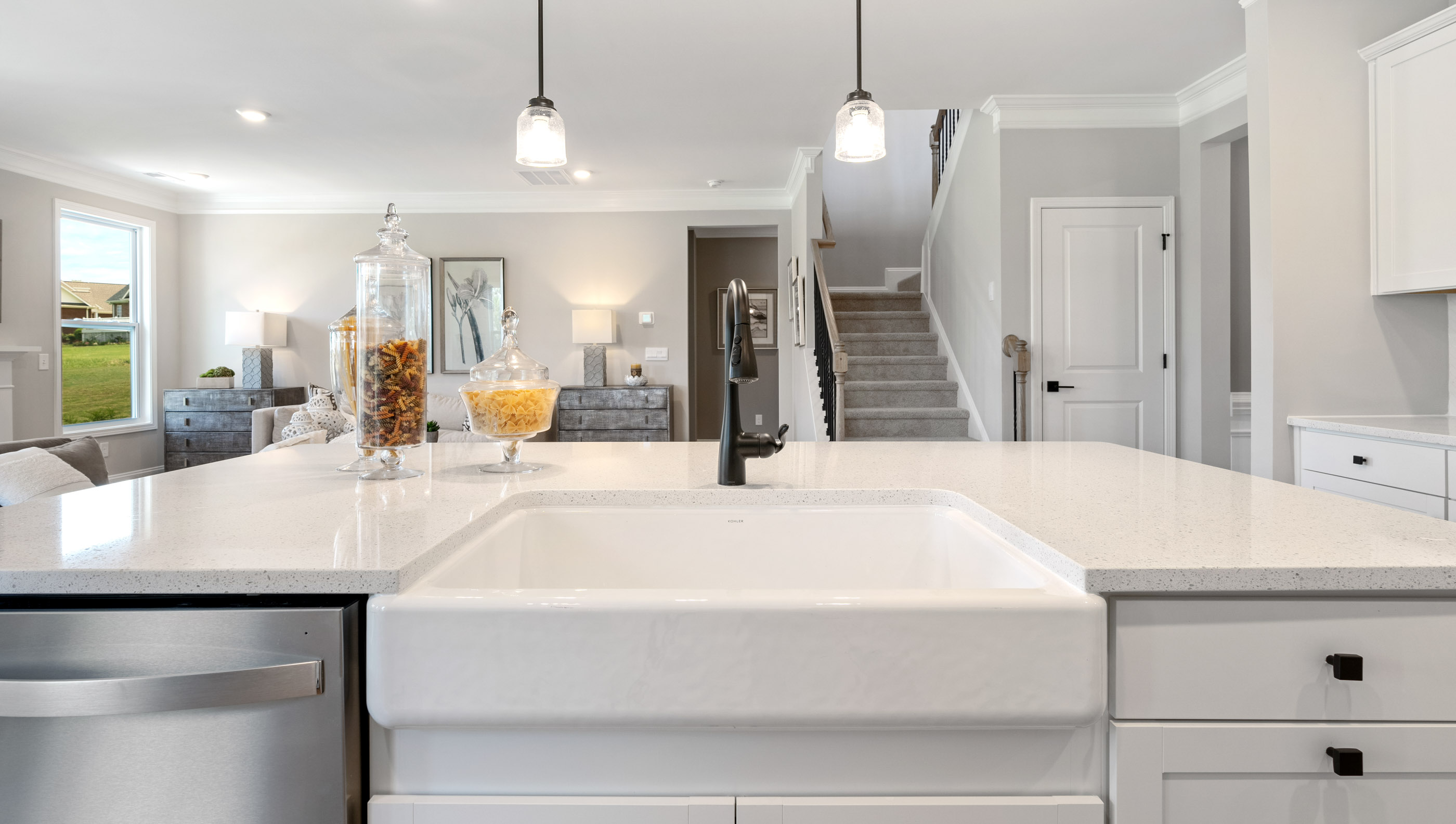 Kitchen and island with granite counter tops.