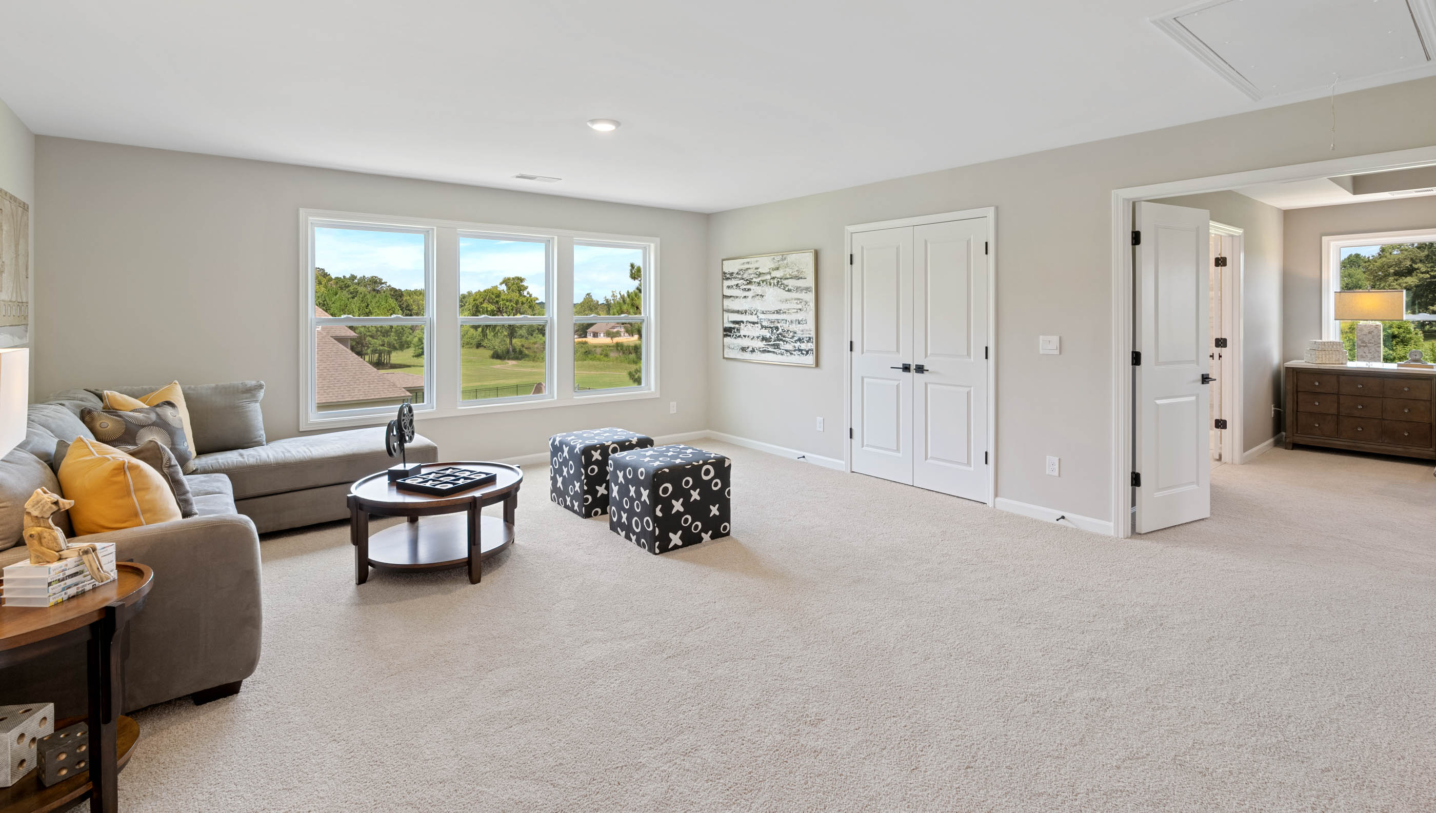 Loft area of home with windows.