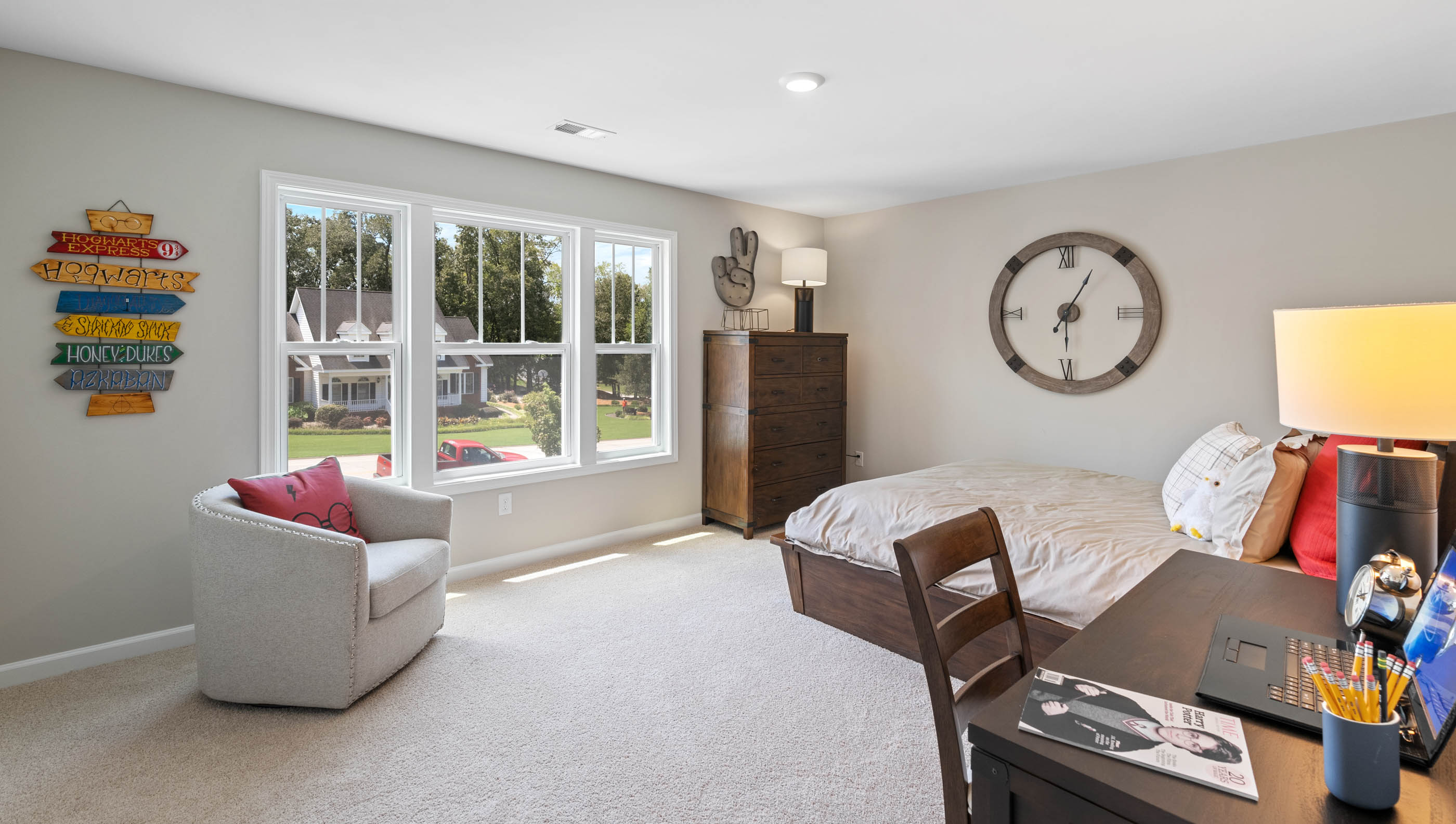 Bedroom with carpet and window.