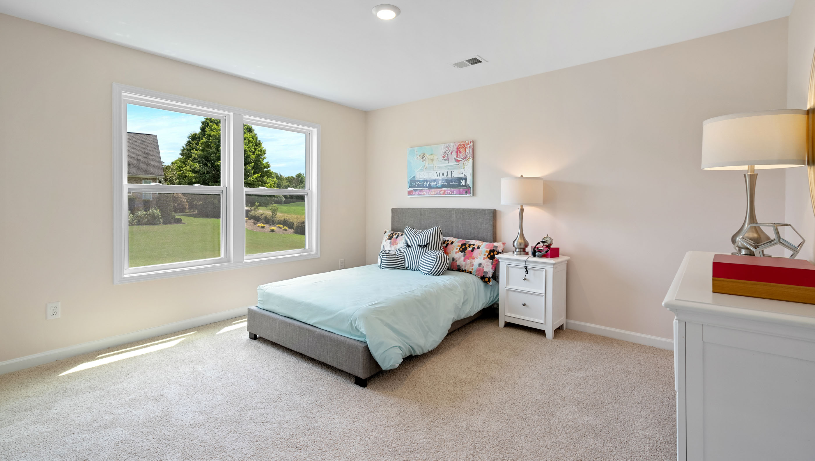 Bedroom with carpet and window.
