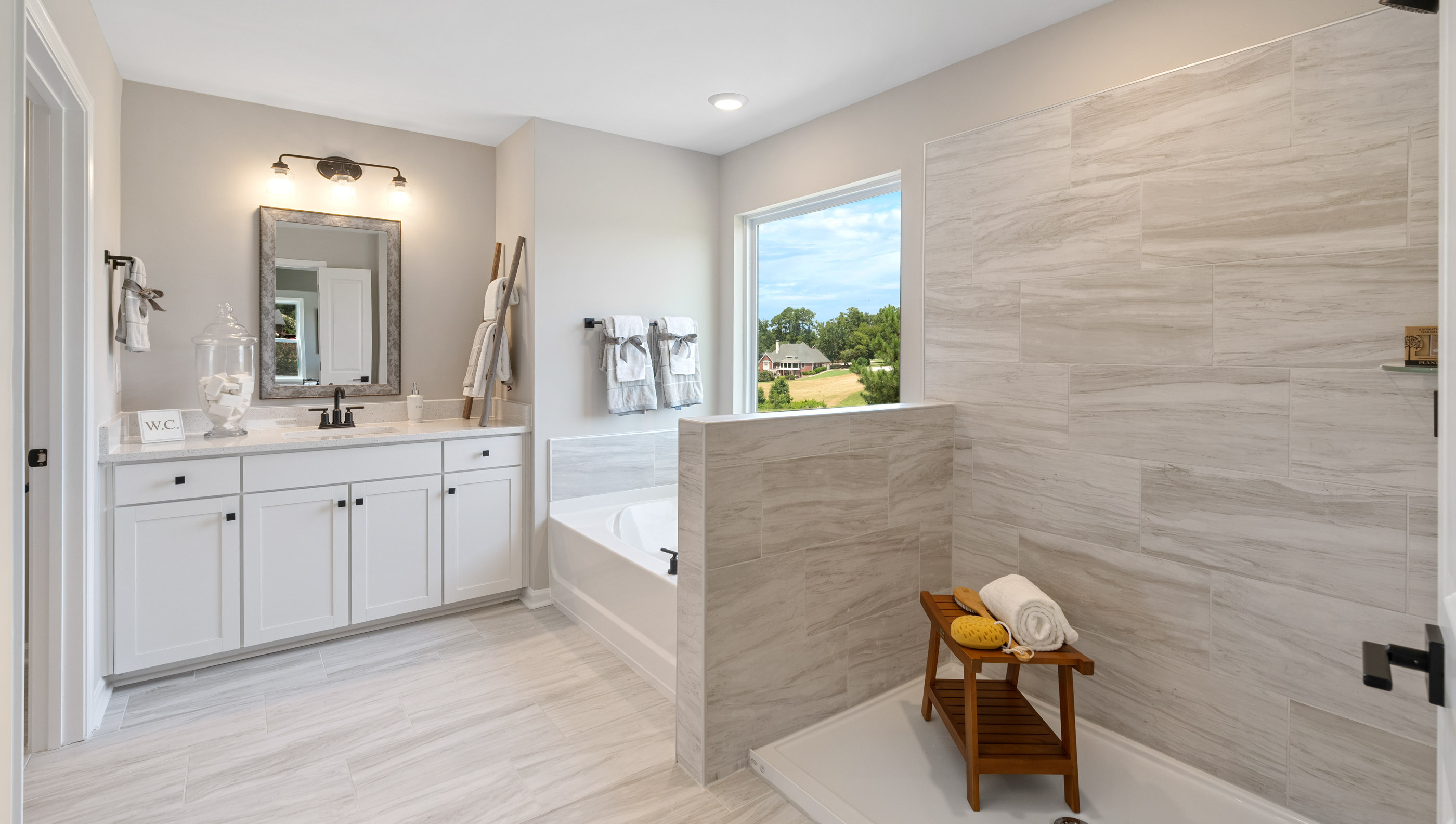 Primary bathroom with vanity and shower.