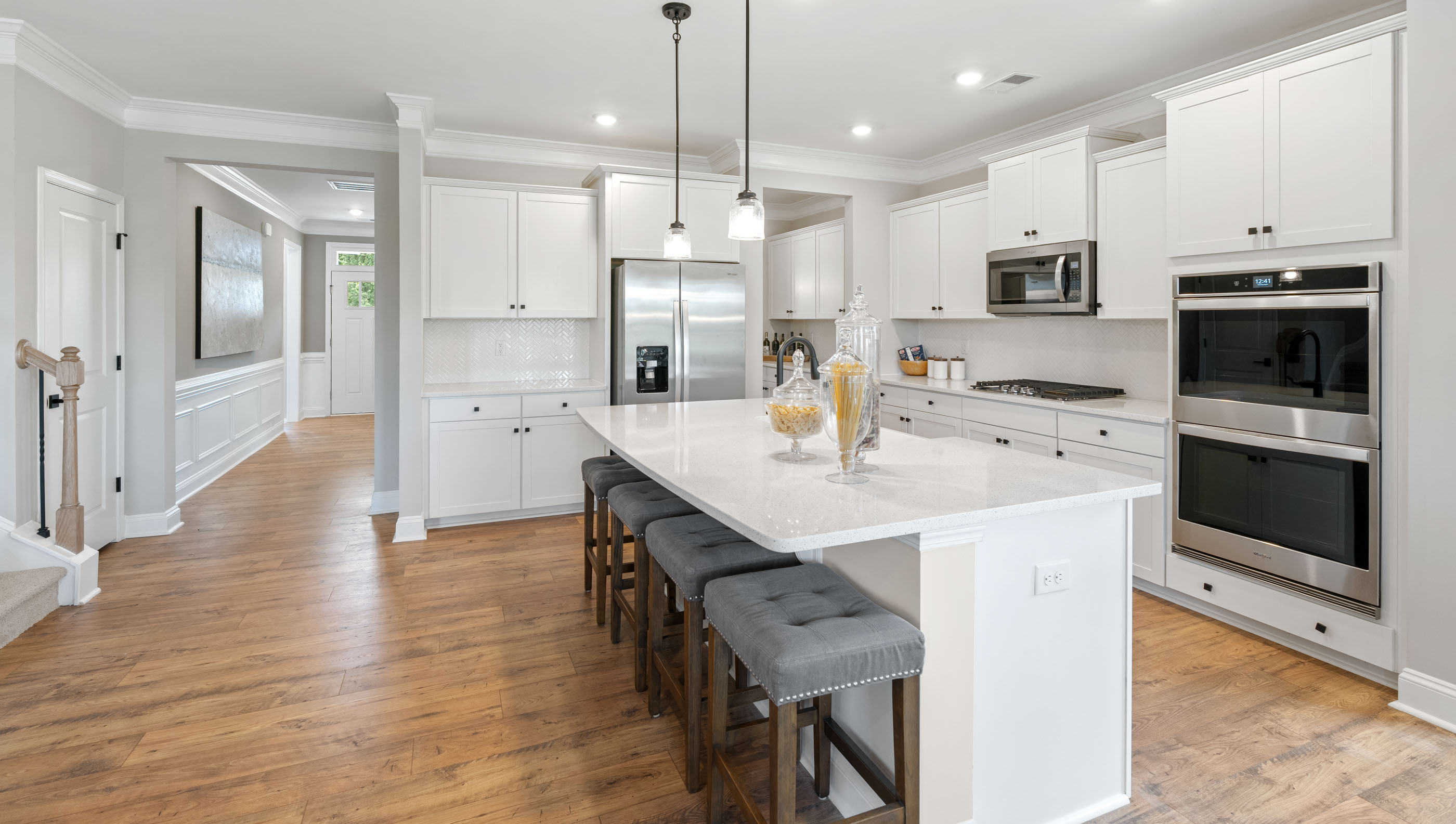 Kitchen and island with granite counter tops.
