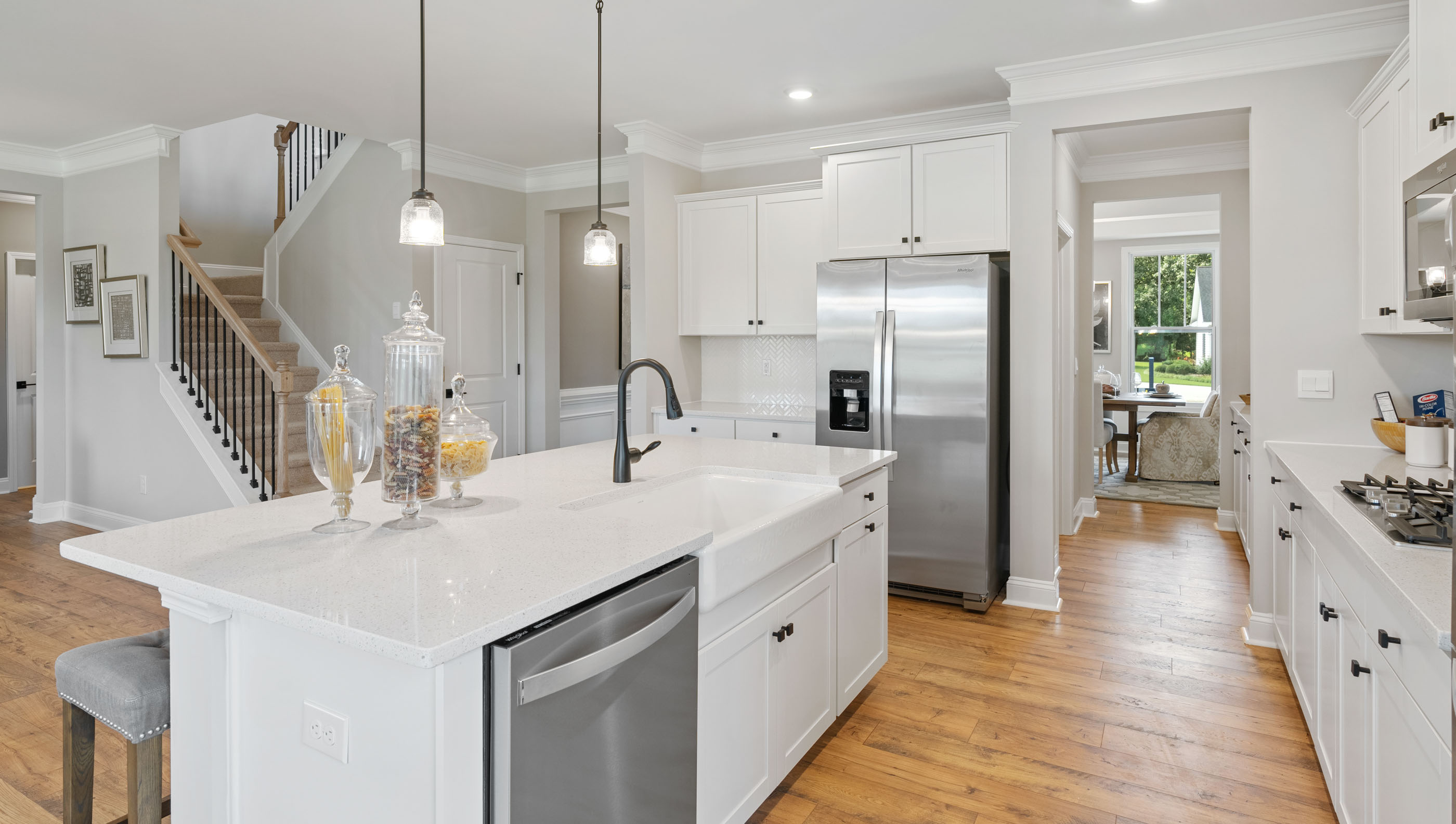 Kitchen and island with granite counter tops.