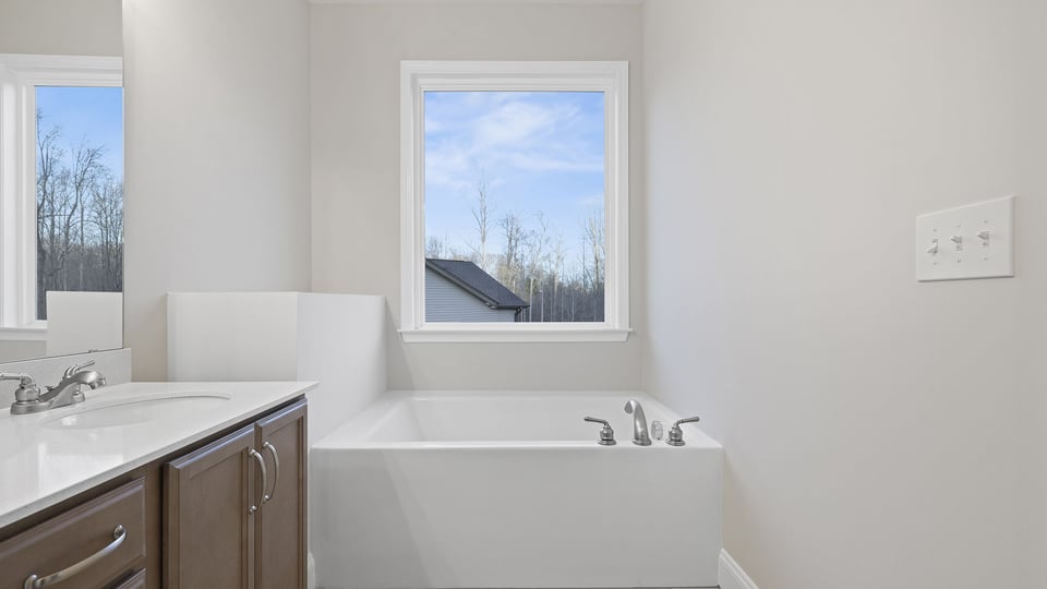 Primary bathroom with window.