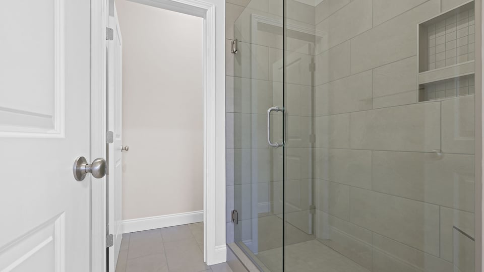 Primary bathroom with window.