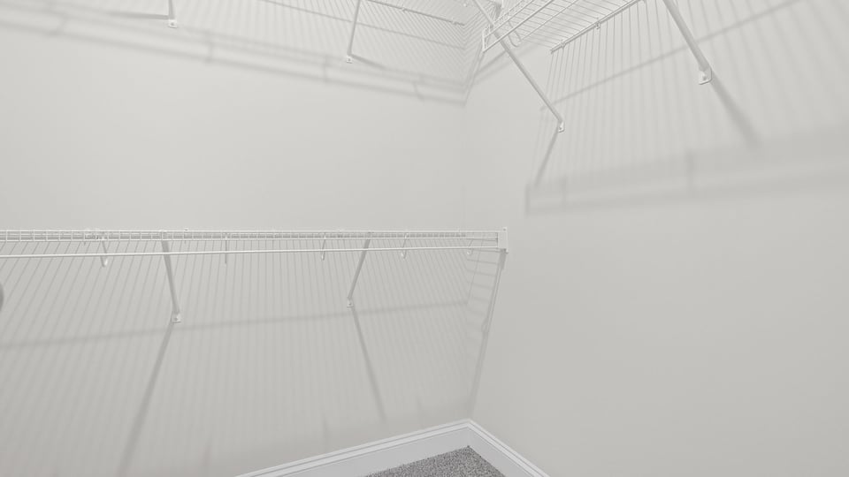 Primary closet with shelf.