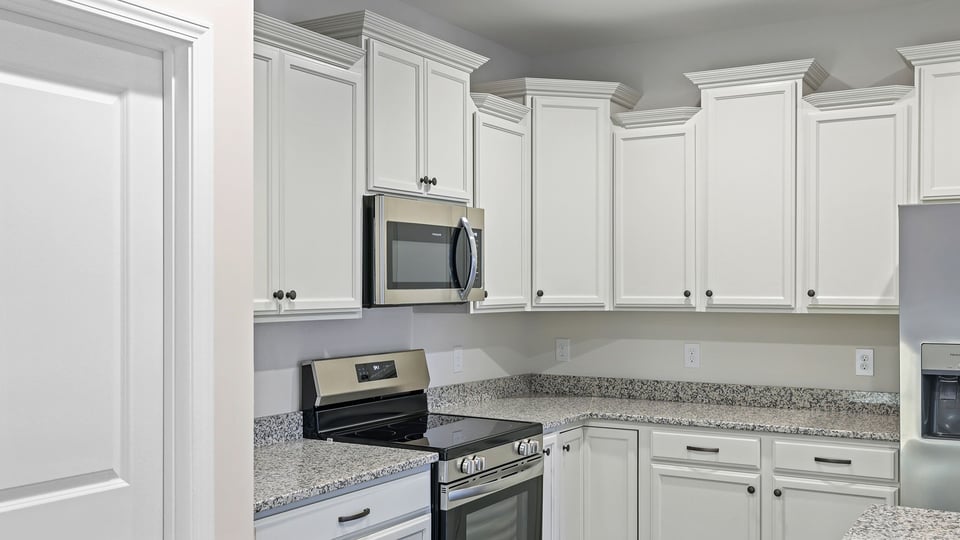 Kitchen with island and cabinets.