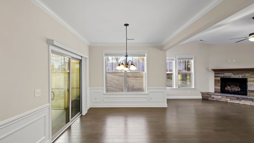 Living room with windows and fireplace.