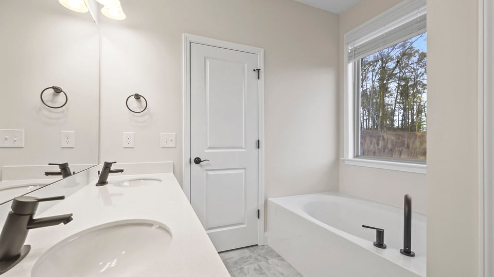 Primary bathroom with double vanity sink.