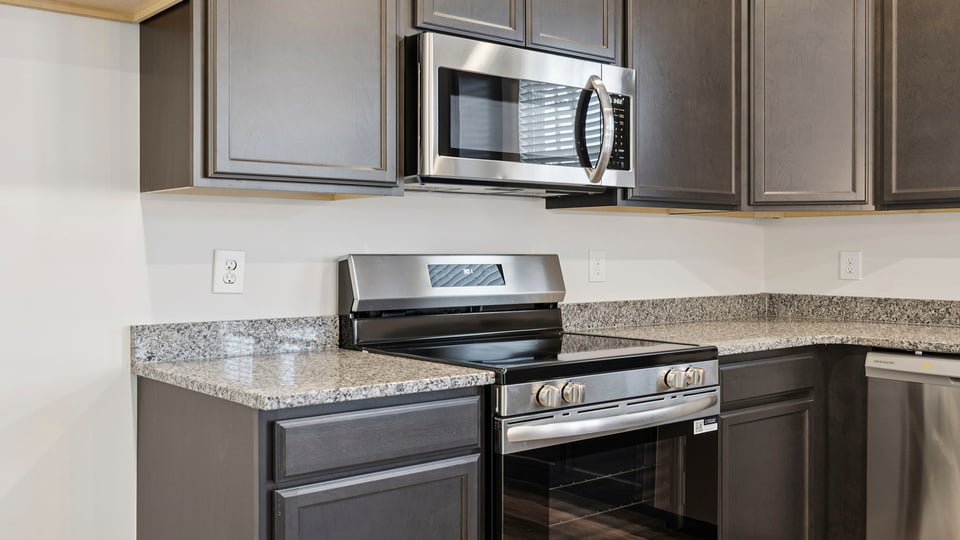 Kitchen with island and cabinets.