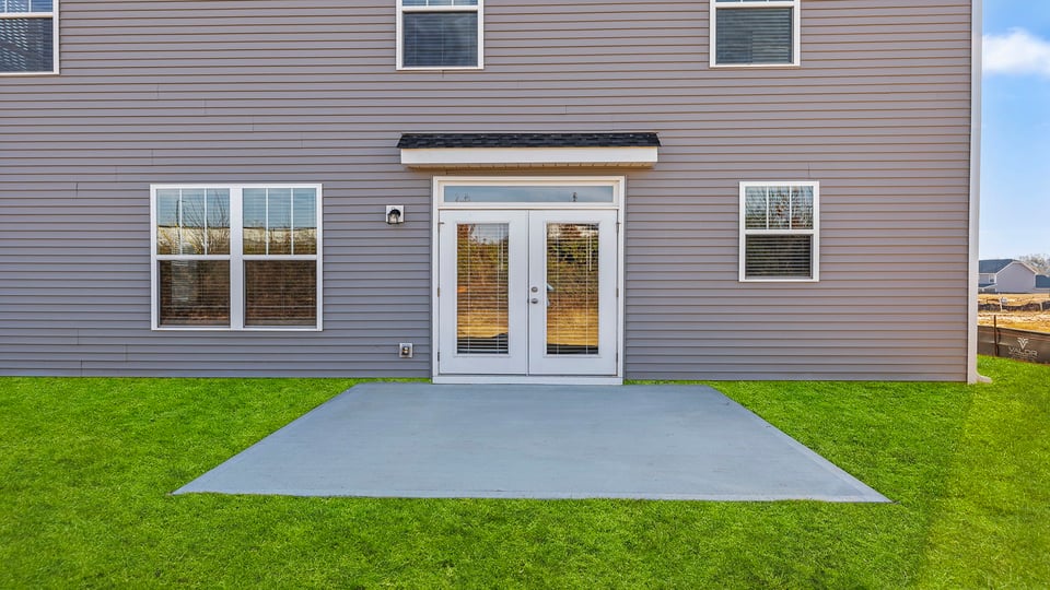 Back exterior with patio.