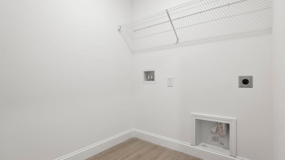 Laundry room with shelf.