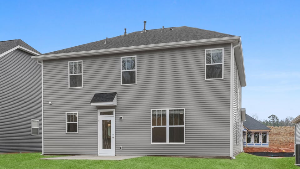 Back exterior with large backyard.