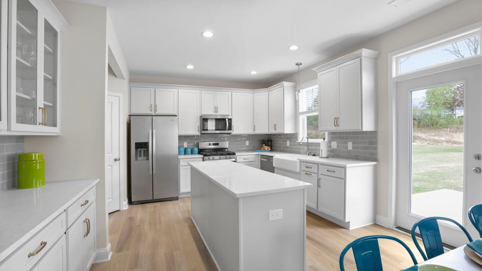 Kitchen with island and cabinets.
