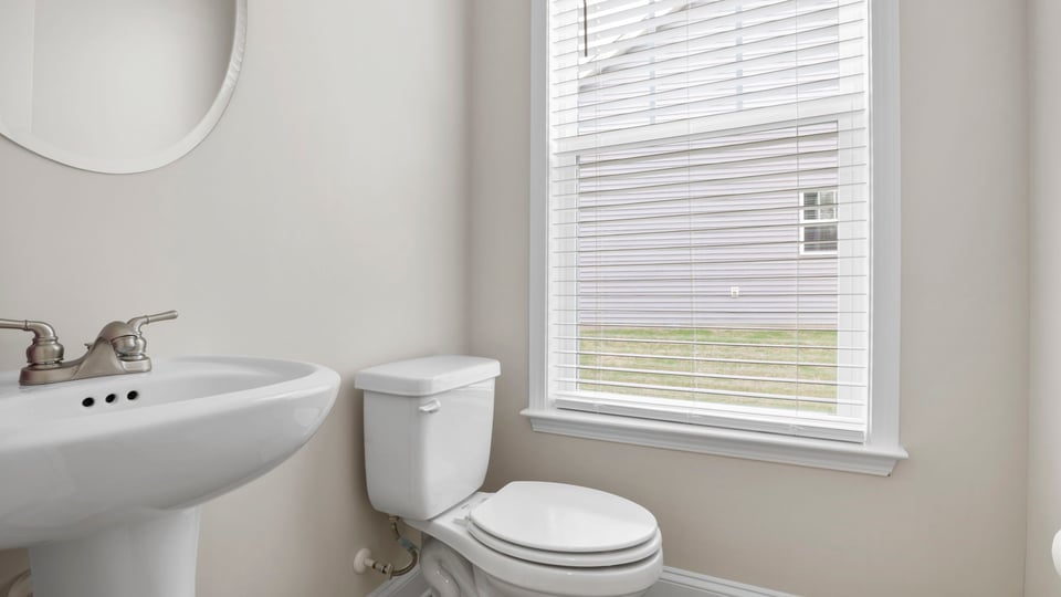 Half bathroom with sinks.