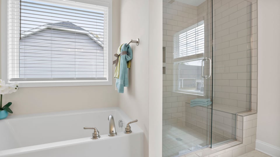 Primary bathroom with double vanity sinks.