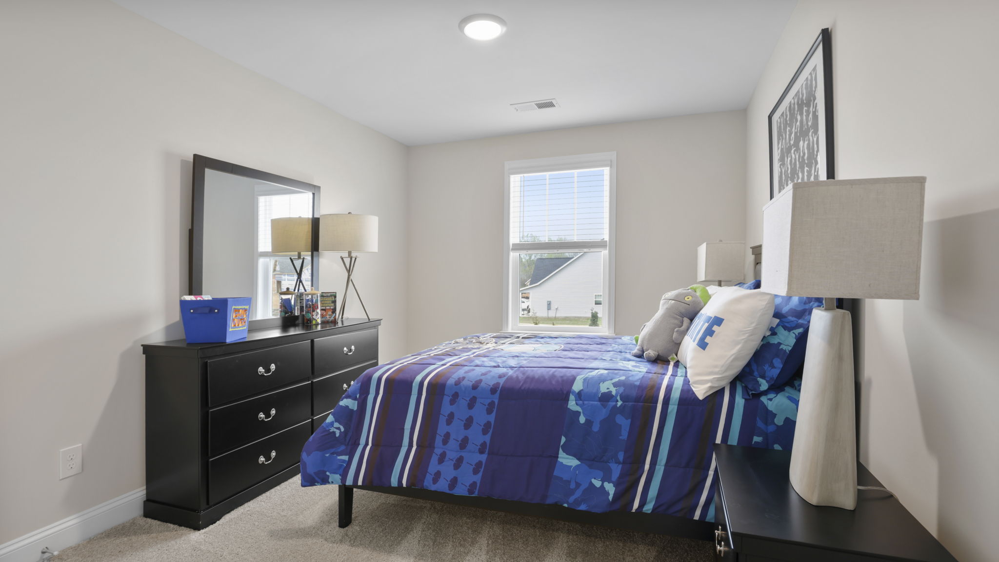 Bedroom with carpet and window.