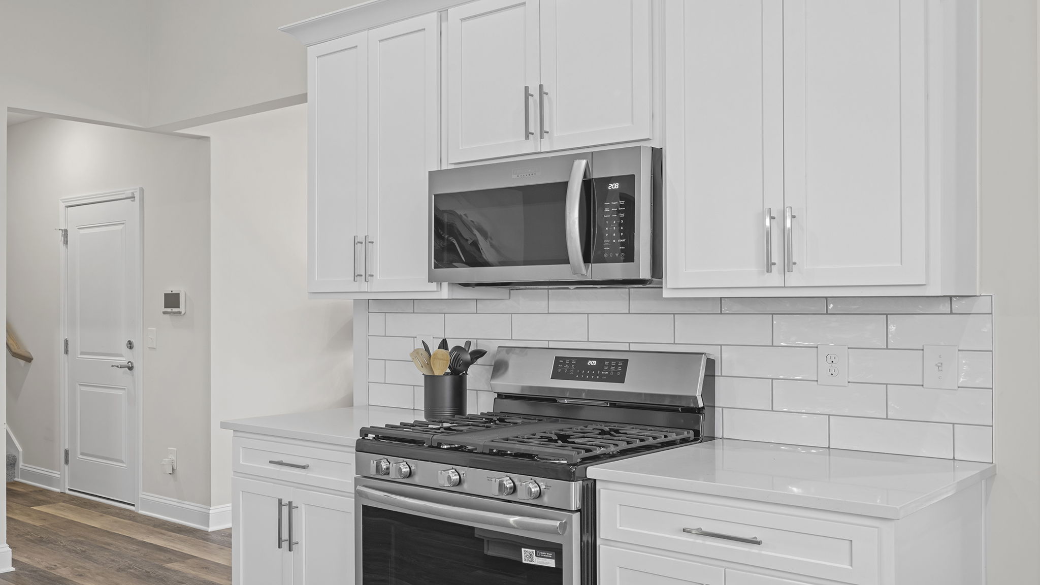 Kitchen with island and cabinets.