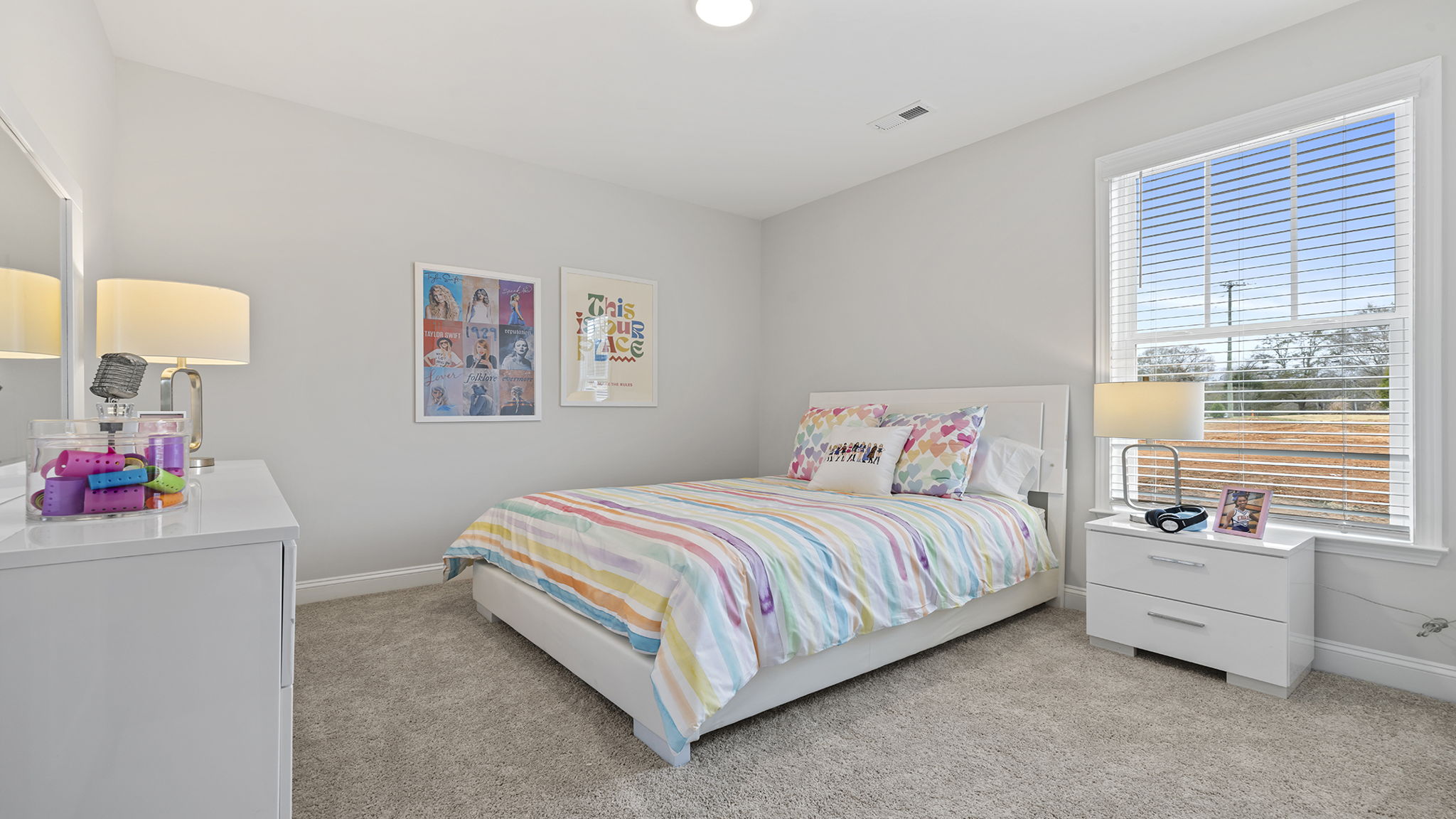 Bedroom with carpet and window.
