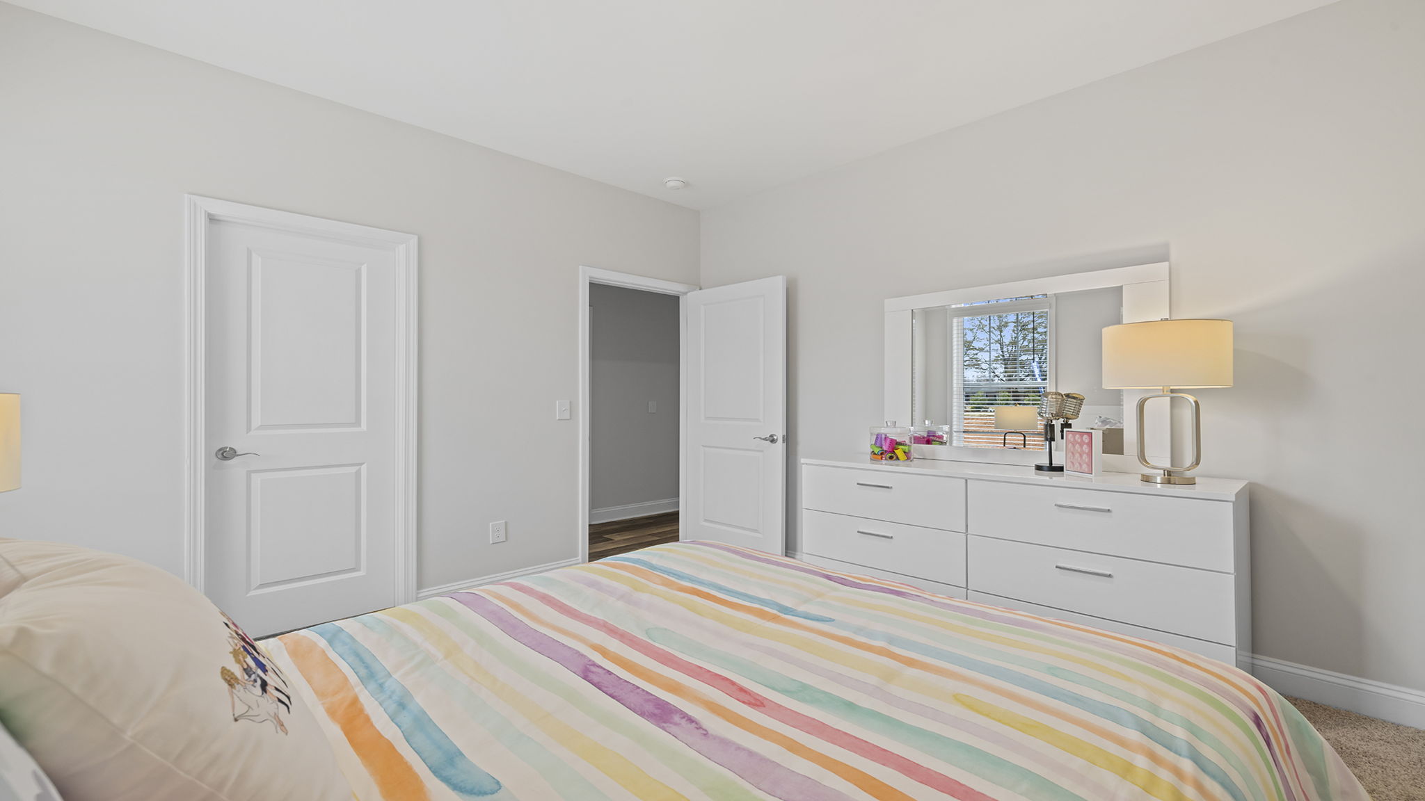 Bedroom with carpet and window.