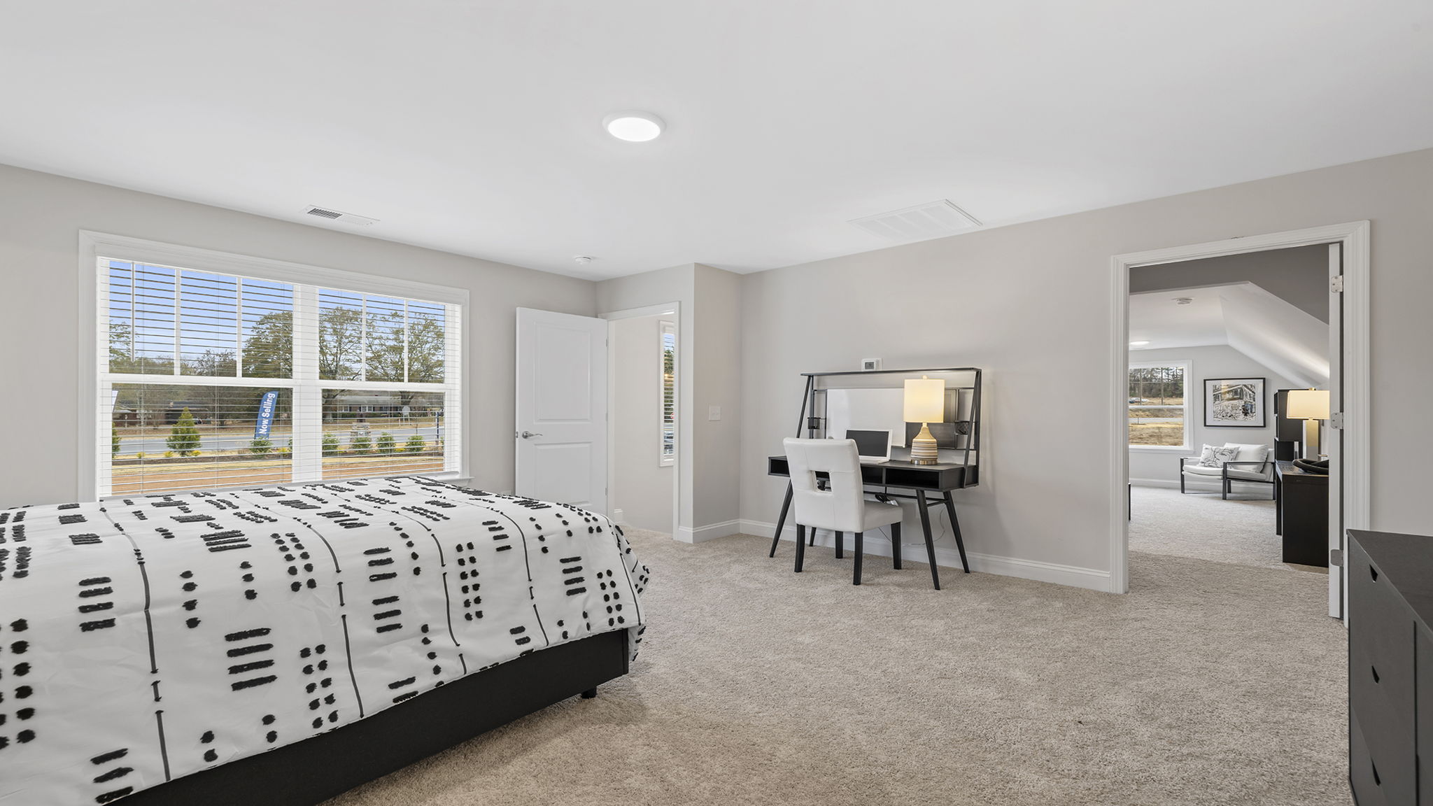 Bedroom with carpet and window.