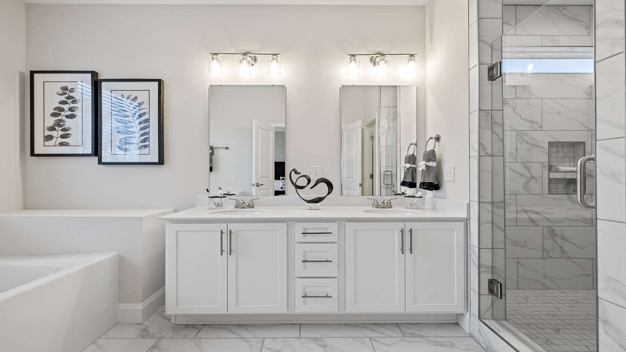 Primary bathroom with double vanity sinks.